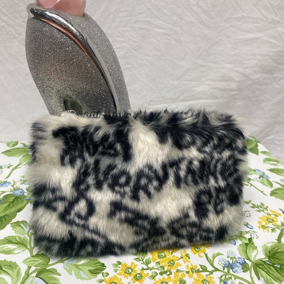 UGG Handbags - UGG zipper clutch White and Black color.